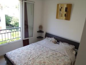 Postel nebo postele na pokoji v ubytování Appartement Les Alizés