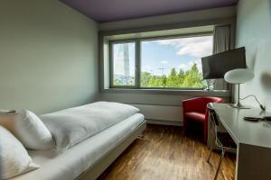 Μια τηλεόραση ή/και κέντρο ψυχαγωγίας στο Dasbreitehotel am Rhein