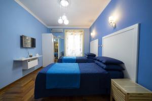 A bed or beds in a room at B&B 'O Sole Mio!