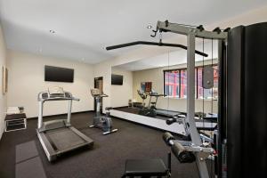 a gym with two treadmills and two machines at Quest Fremantle in Fremantle