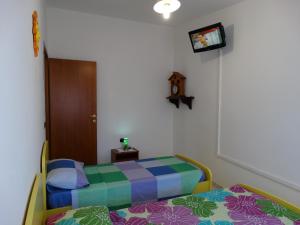 Postel nebo postele na pokoji v ubytování Appartamento La Collinetta