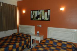 Voodi või voodid majutusasutuse Hotel Fernando toas