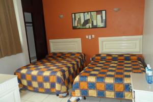 Una cama o camas en una habitación de Hotel Fernando