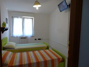 Postel nebo postele na pokoji v ubytování Appartamento La Collinetta