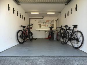 two bikes are parked in a garage at Hotel Luna Garni in Ascona