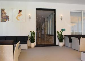 Predel za sedenje v nastanitvi Hotel Luna Garni