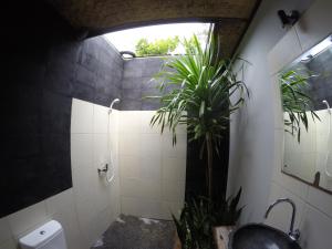 Een badkamer bij Alexyane Paradise Bungalow