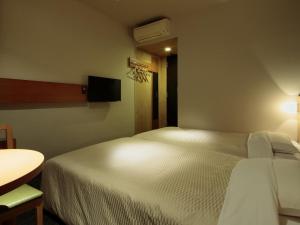 TV a/nebo společenská místnost v ubytování Candeo Hotels Sano