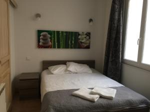 Postel nebo postele na pokoji v ubytování Résidence Natura