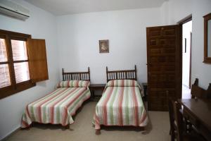 Ένα ή περισσότερα κρεβάτια σε δωμάτιο στο Las Banderas +42 φωτογραφίες
