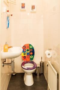 a bathroom with a toilet and a sink at Studio RoSa in Nijmegen