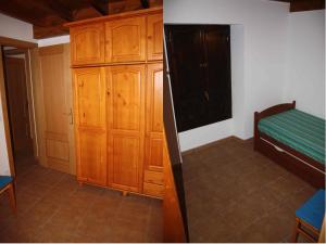 A bed or beds in a room at El Pontarron Apartamentos