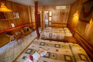 Uma cama ou camas num quarto em Hotel Manavai
