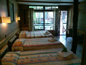 Uma cama ou camas num quarto em Hotel Manavai