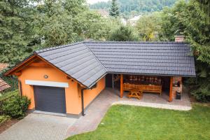 an overhead view of a small house with a garage at Apartmány U Červeného stromu in Rožnov pod Radhoštěm