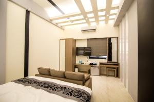 Кровать или кровати в номере Ai Lian Shan Shui Homestay