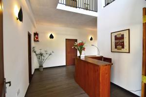 an office with a hallway with a desk at Park Lane 88 Apartments in Negombo +30 photos