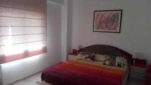 Ένα ή περισσότερα κρεβάτια σε δωμάτιο στο Apartamento Jardín de Ayora