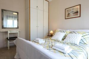 Łóżko lub łóżka w pokoju w obiekcie Pool Apartments Julia