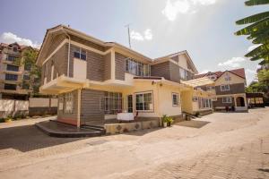 a large house on a street at Wida Resort Kilimani in Nairobi