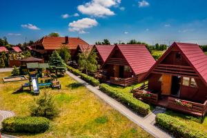 Imagem da galeria de Domki Słoneczko z dostępem do jacuzzi sauny i rowerów em Dźwirzyno