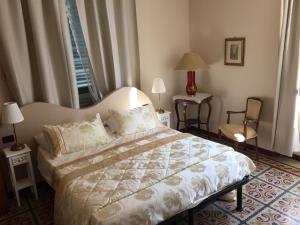 Postel nebo postele na pokoji v ubytování Lucca Relais