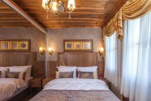 Postel nebo postele na pokoji v ubytování Ferman Konak Hotel-Special Category