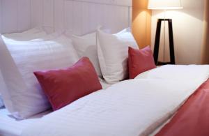 Postel nebo postele na pokoji v ubytování Rudolfo Hotel