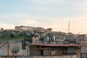 a view of the acropolis of athens from the city at Boutique Central Apartments Acropolis View in Athens