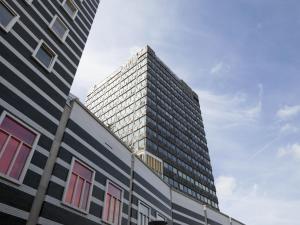 a tall building with windows on the side of it at easyHotel Amsterdam Zaandam in Zaandam