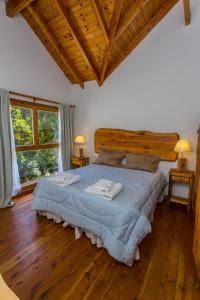Postel nebo postele na pokoji v ubytování Cabañas Villa Sequoia