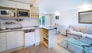 Kuchyň nebo kuchyňský kout v ubytování Bluestars Apartments