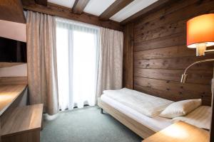 Katil atau katil-katil dalam bilik di Hotel Altmünsterhof