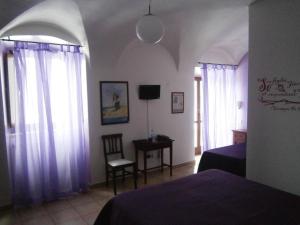 Postel nebo postele na pokoji v ubytování Art Hotel