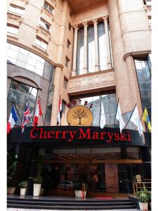 
a building with a sign on the front of it at Cherry Maryski Hotel in Alexandria
