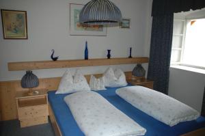 Postel nebo postele na pokoji v ubytování Romantikhaus Hufschmiede