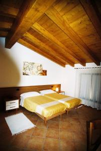 En eller flere senge i et værelse på Il Grappolo D' Oro