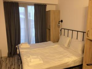 Postel nebo postele na pokoji v ubytování Gudauri Loft Apartment N510
