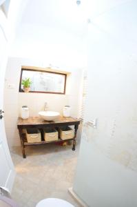 a bathroom with a sink and a mirror at Poarta Ecaterina Residence in Braşov +27 photos