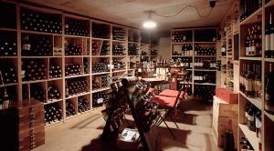 a room filled with lots of bottles of wine at Hotel Aida in Alassio