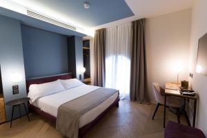Postel nebo postele na pokoji v ubytování Hotel Silla