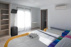 Postel nebo postele na pokoji v ubytování Hostal Pardo