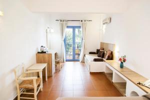 a living room with a couch and a table at Elpida Village in Istro