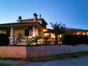 a house with a fence in front of it at Elisa House in Foligno