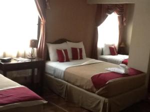 Voodi või voodid majutusasutuse La Bellota Hotel toas
