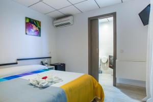 Postel nebo postele na pokoji v ubytování Hostal Pardo