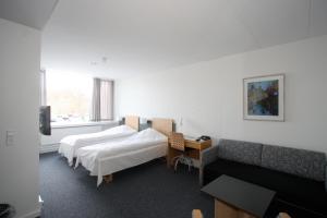 Postel nebo postele na pokoji v ubytování Vingsted Hotel & Konferencecenter