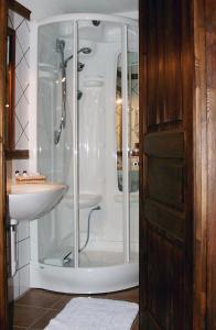 a bathroom with a shower and a sink at Le Village in Montjovet +17 photos