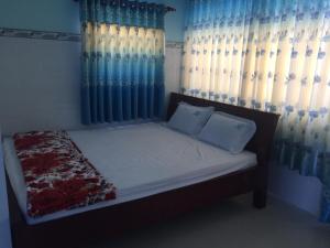 Giường trong phòng chung tại HOTEL Thành Nam