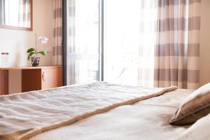 Postel nebo postele na pokoji v ubytování Hotel Fabbrini